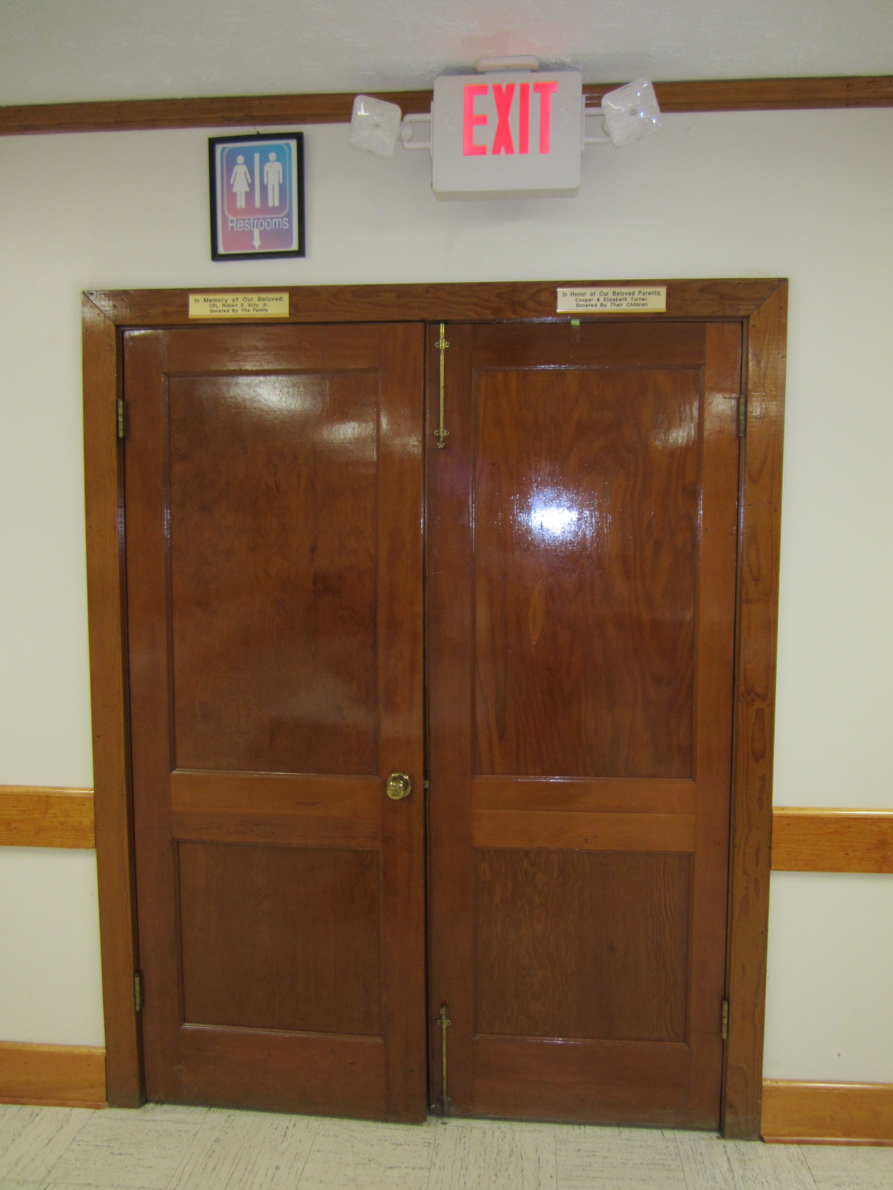 Double doors leading to hall and bathrooms